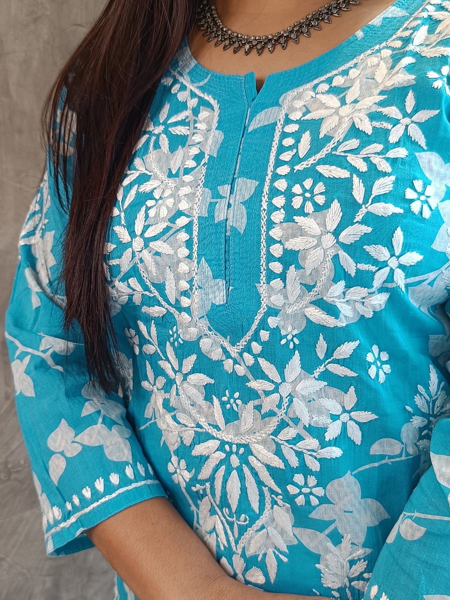 "Close-up of handmade Chikankari embroidery on mal-mal kurti - Loomkar Raipur Chhattisgarh"