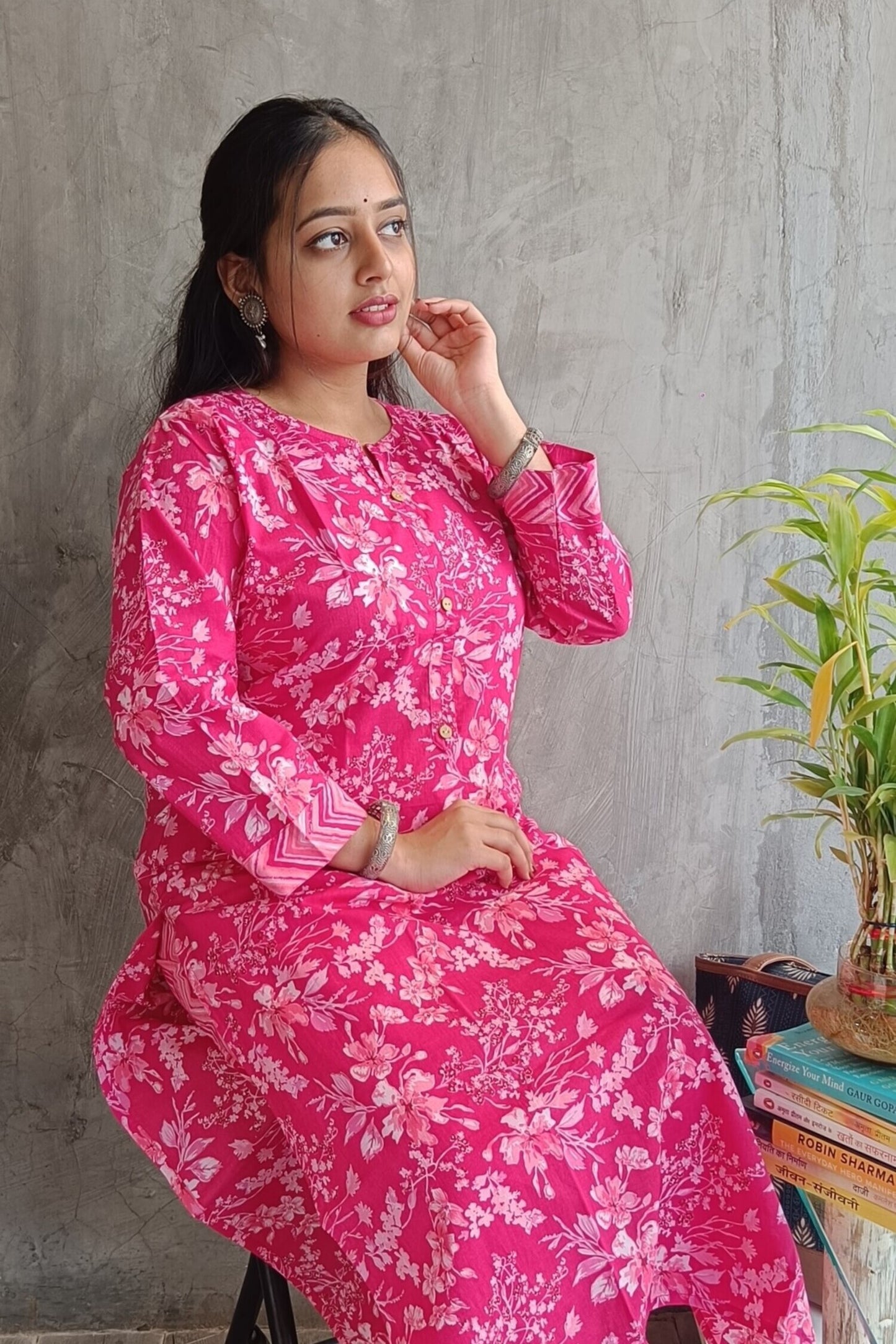 "Side view of woman wearing Loomkar bright pink floral handloom cotton co-ord set ideal for office or causal wear."