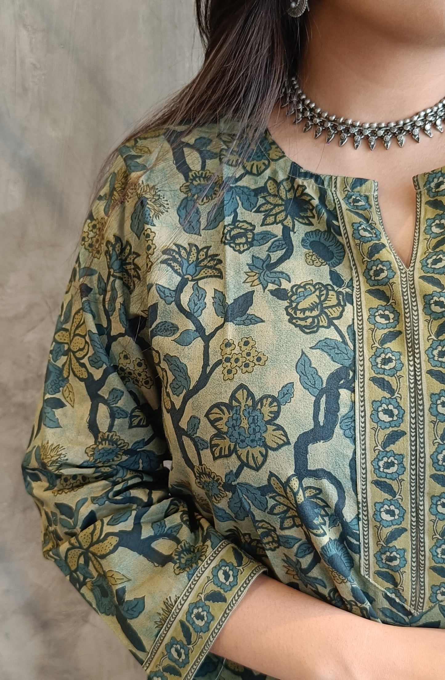 "Detail shot of artisan floral print on Loomkar's green vanaspati handloom cotton co-ord set in raipur."