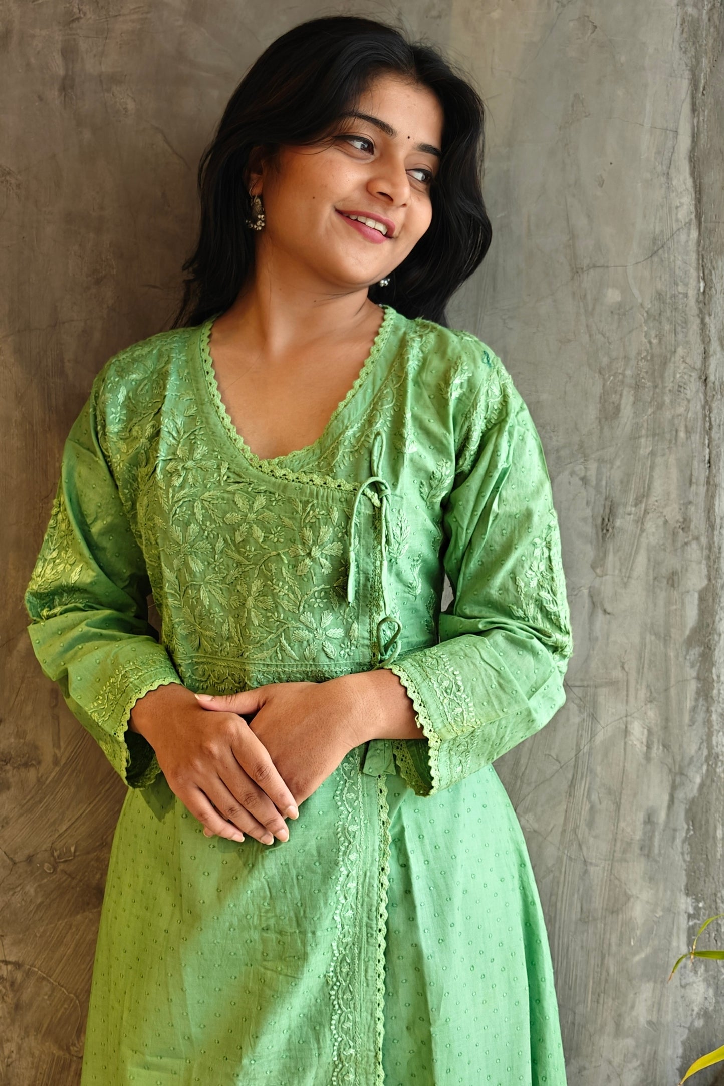 "Model wearing Loomkar Light Green A-Line Long Chikankari Kurta paired with palazzo pants. "