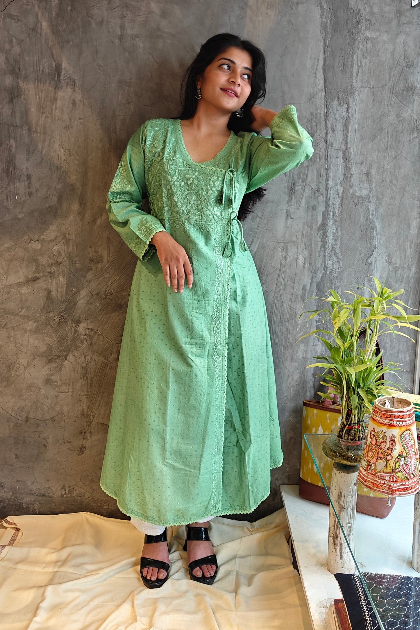 "Full-length image o" light green A-Line Chikankari kurta - traditional handloom wear from Raipur."