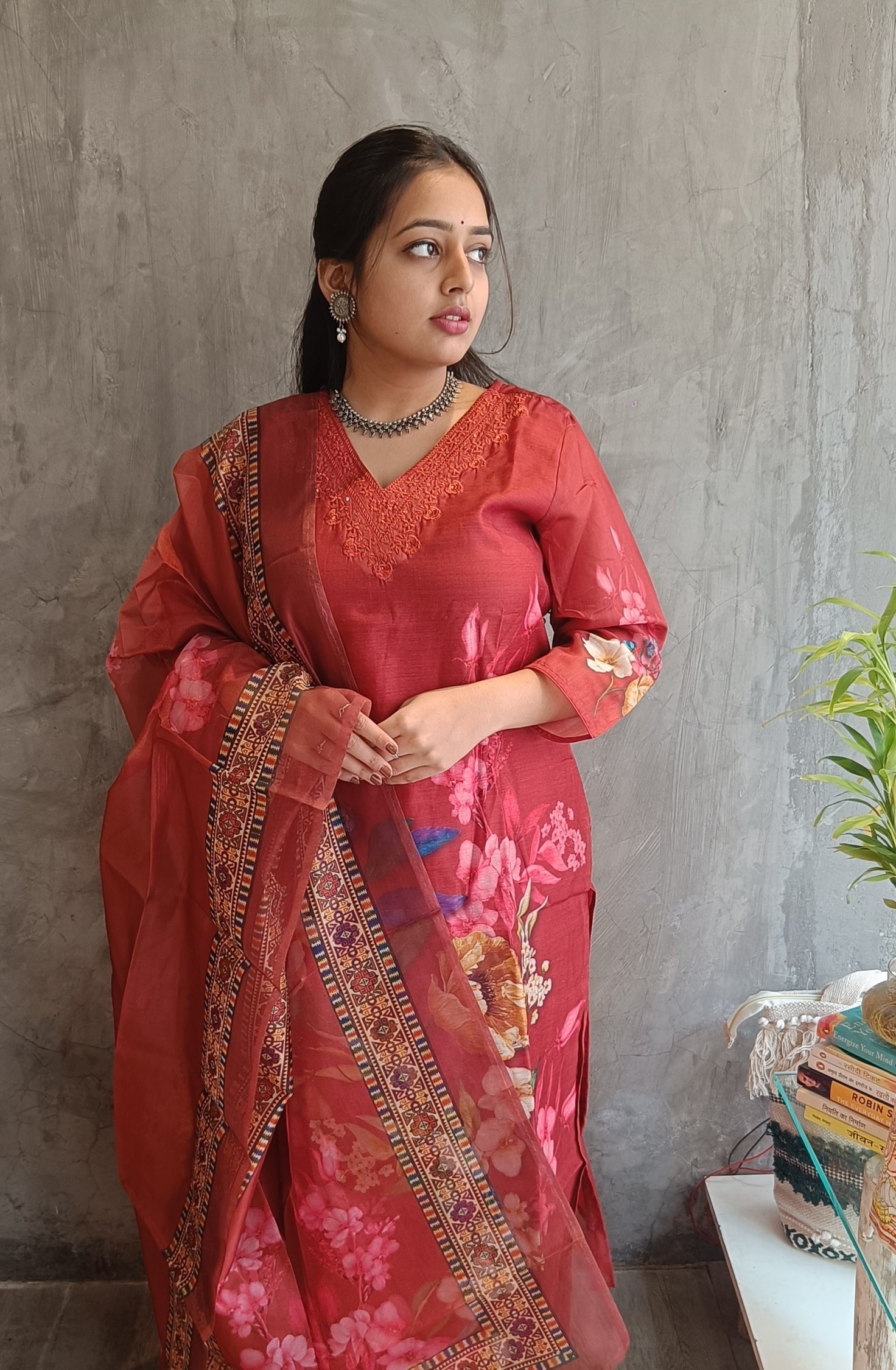 Detailed view of floral dupatta paired with rust red cotton silk kurti set