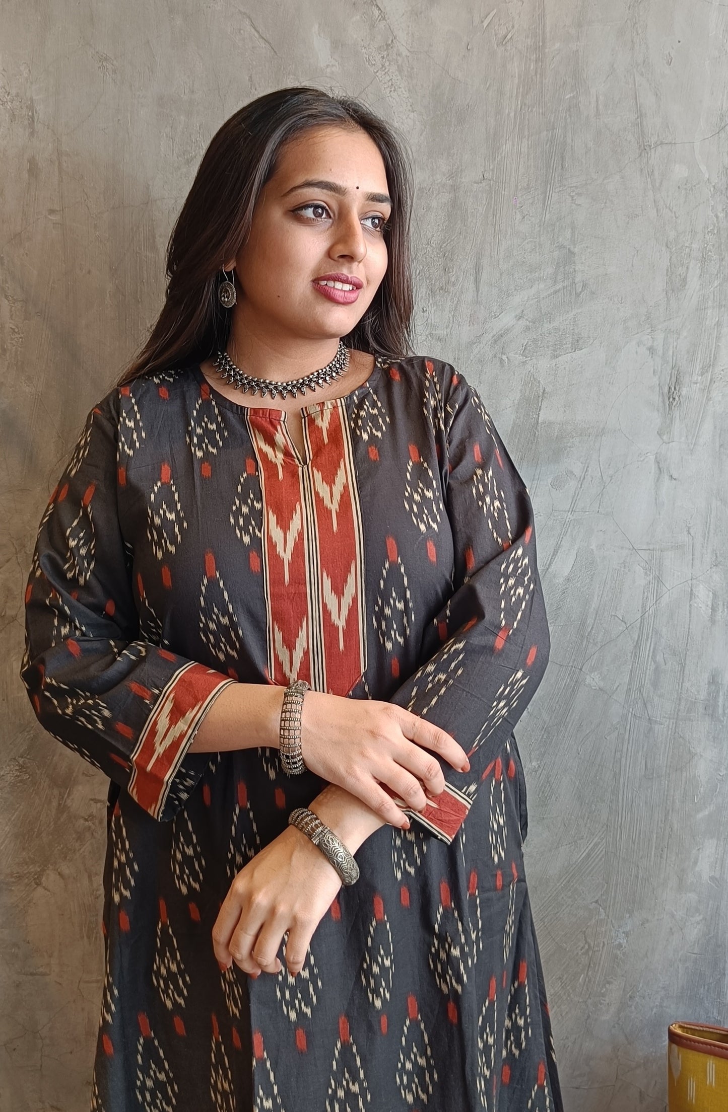 Hand screen-printed black Ikat kurti with rust Afghani pants- Loomkar 