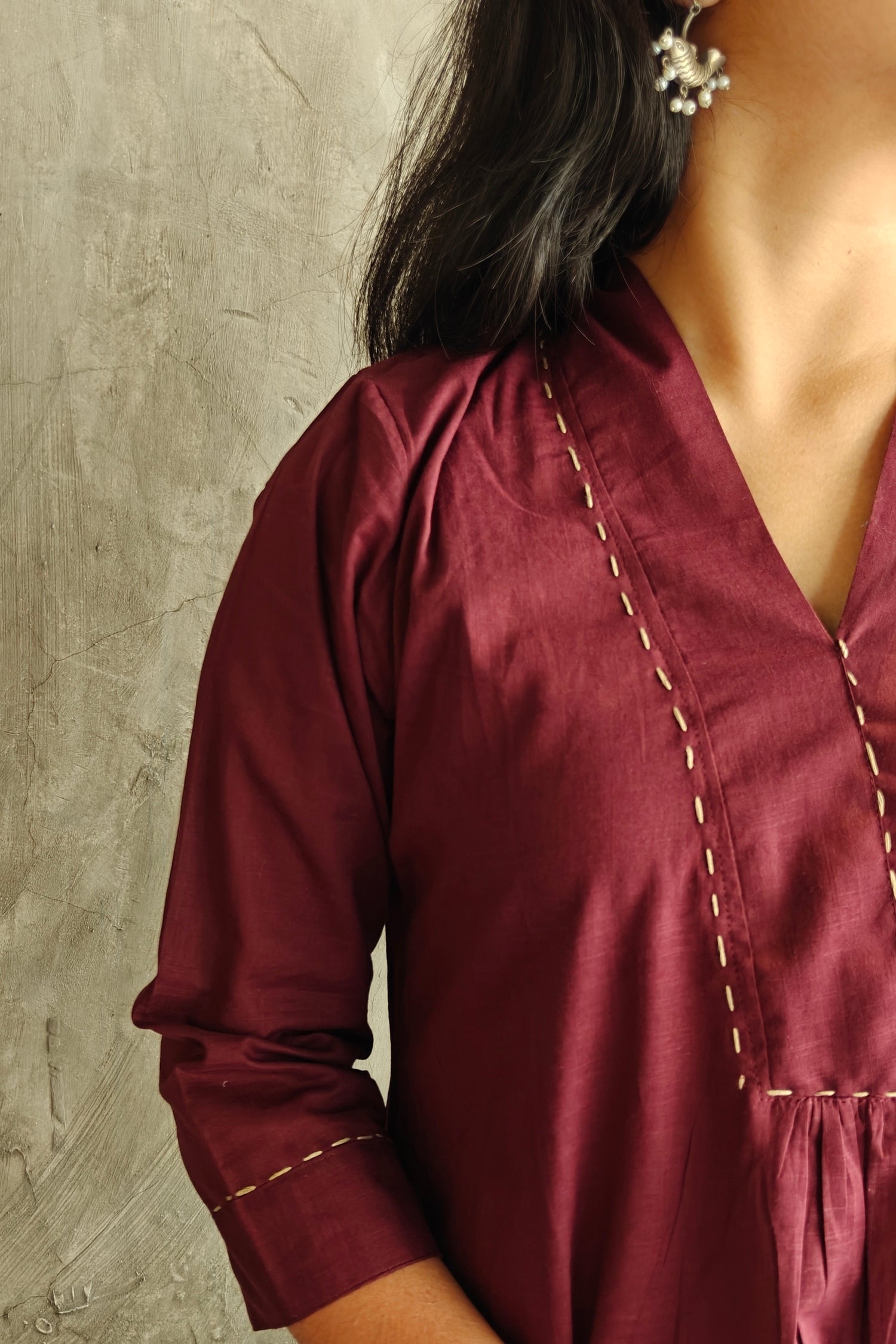 Close-up of Deep Wine Cotton Suit Set showing neckline and embroidery details.