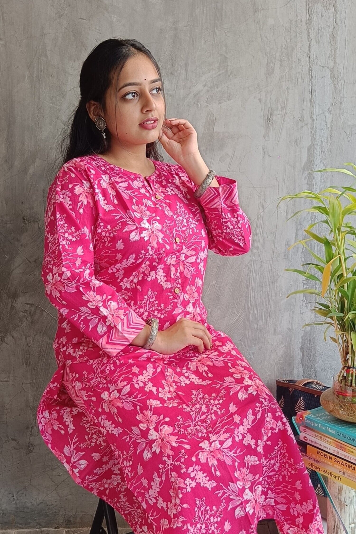 "Side view of woman wearing Loomkar bright pink floral handloom cotton co-ord set ideal for office or causal wear."