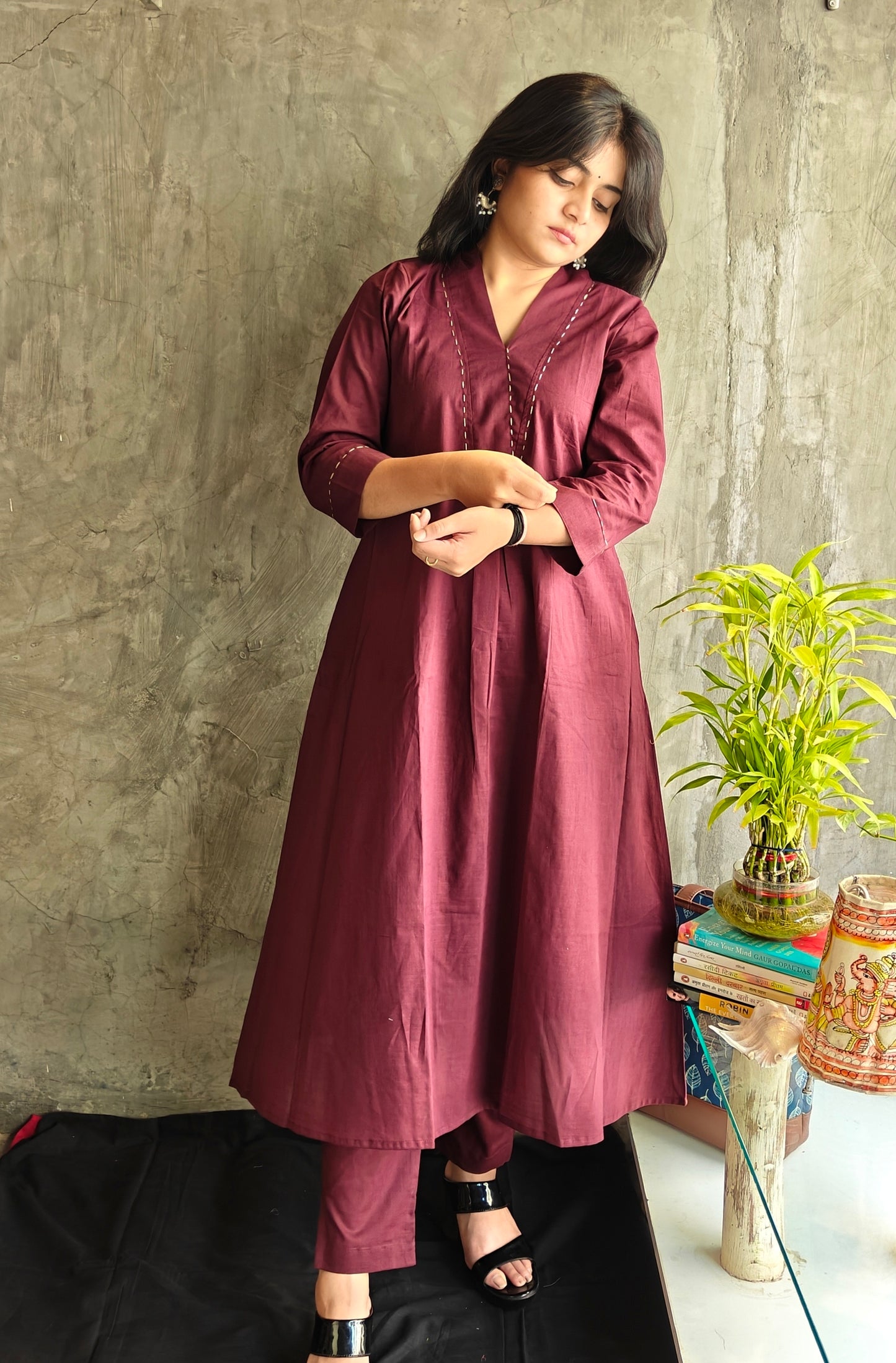 Model wearing Deep Wine Cotton Suit Set showing neckline and embroidery details.