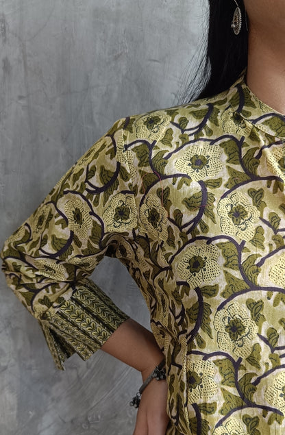 "Detail shot of hand screen-printed floral motifs on Loomkar green co-ord set kurti and pants."
