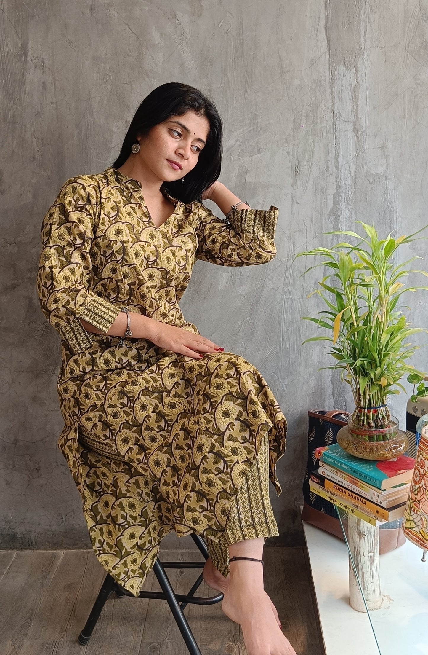 "Side view of woman wearing Loomkar green floral handloom cotton co-ord set ideal for office or casual wear."