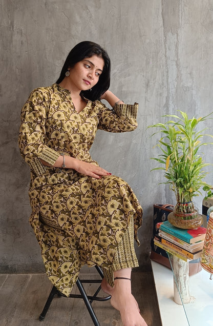 "Side view of woman wearing Loomkar green floral handloom cotton co-ord set ideal for office or casual wear."