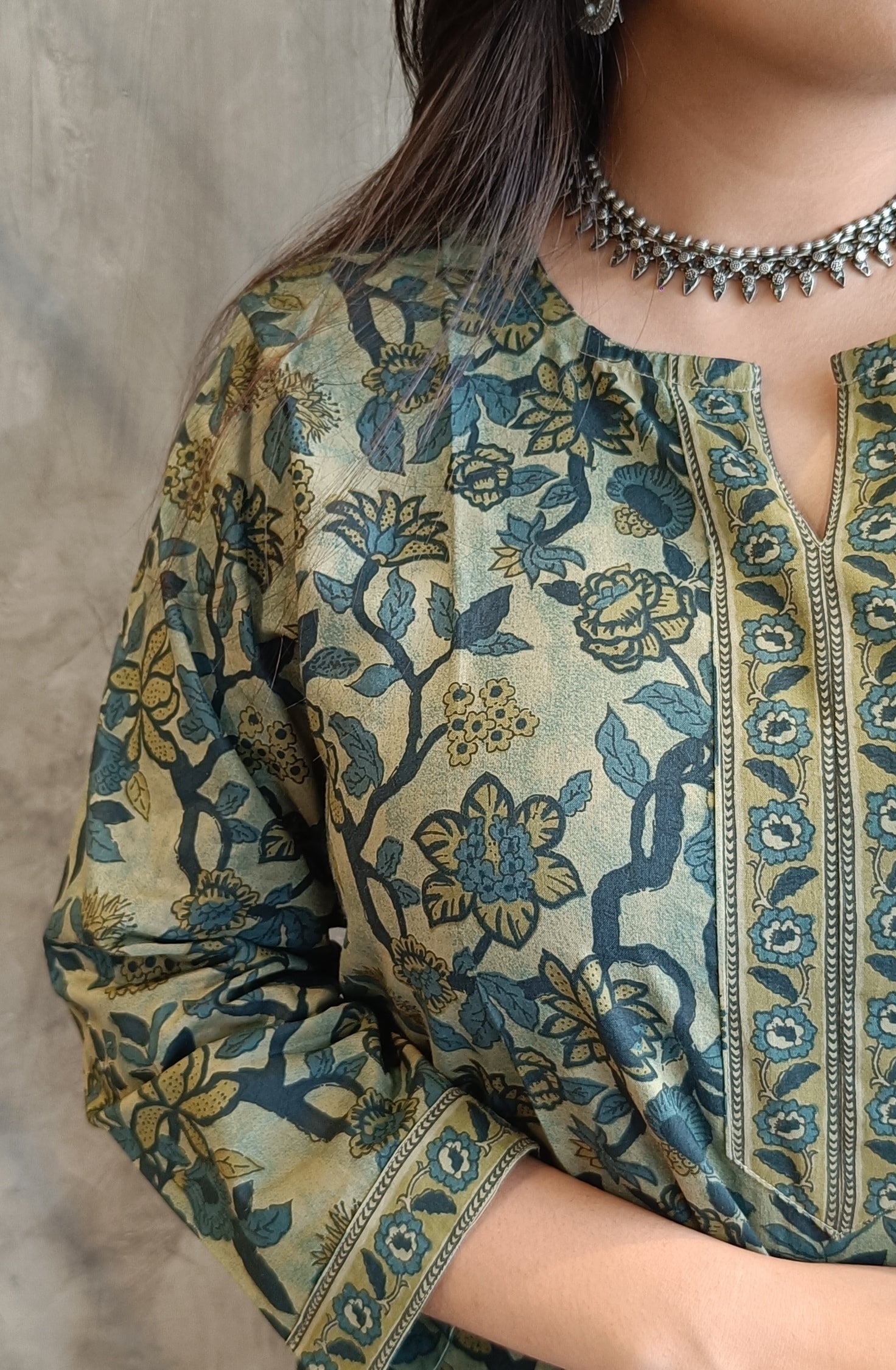 "Detail shot of artisan floral print on Loomkar's green vanaspati handloom cotton co-ord set in raipur."