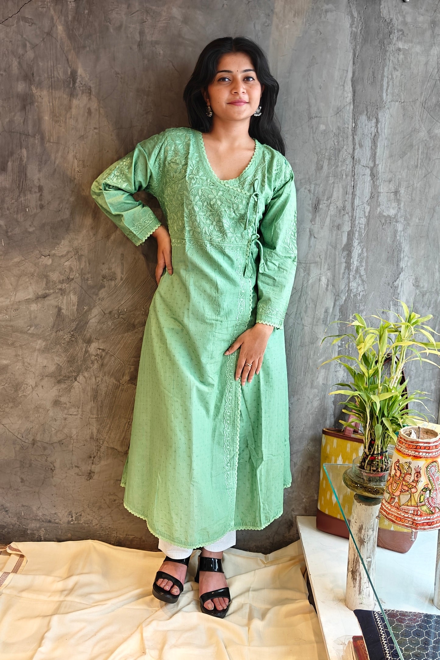 "Model wearing a light green Chikankari kurta showing intricate hand embroidery"