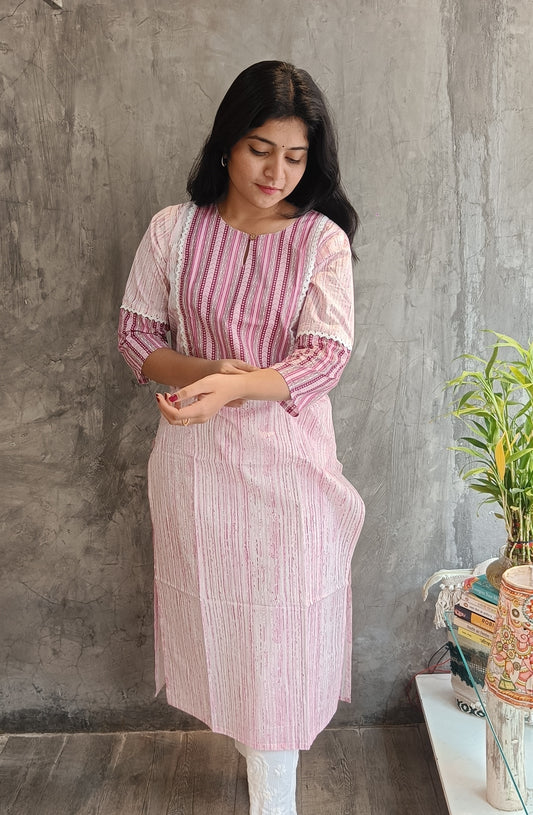 "Front view of Loomkar's soft pink floral handloom cotton kurti in Raipur, showing the elegant straight-fit ethnic design."