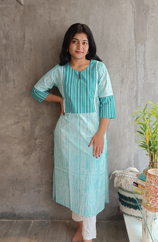 "Front view of a woman wearing Loomkar's tail green floral handloom cotton kurti in Raipur, showing the elegant straight-fit design."